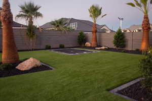 View of fenced backyard