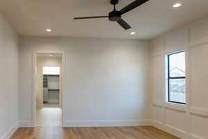 Spare room with light wood-type flooring, recessed lighting, and ceiling fan
