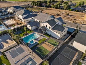 Aerial perspective of suburban area with a pool