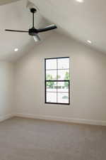 Spare room with light colored carpet, recessed lighting, lofted ceiling, and a ceiling fan