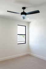 Empty room with light colored carpet, recessed lighting, and a ceiling fan