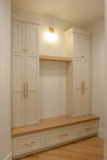 Mudroom with light wood-style flooring