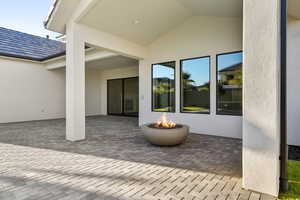 View of patio / terrace featuring an outdoor fire pit