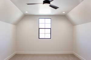Additional living space featuring light colored carpet, vaulted ceiling, recessed lighting, and ceiling fan