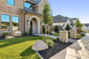 View of front facade featuring brick siding