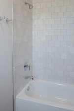 Bathroom featuring tub / shower combination