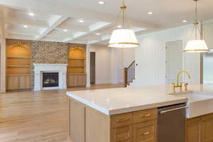 Kitchen with open floor plan, recessed lighting, decorative light fixtures, light wood-style floors, and dishwasher
