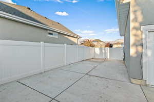 Fenced backyard with a patio area