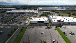Bird's eye view of mountains and a commercial area