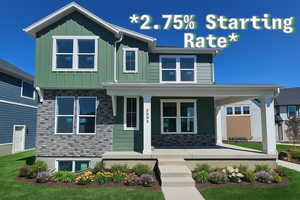 View of front of property with covered porch, board and batten siding, and stone siding