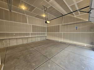 Garage featuring a garage door opener