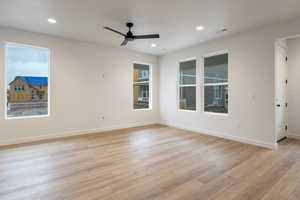 Spare room with light wood-type flooring, recessed lighting, and a ceiling fan