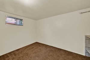Empty room featuring carpet flooring