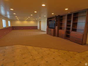 Unfurnished living room with recessed lighting and light carpet