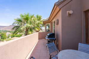 Balcony featuring area for grilling