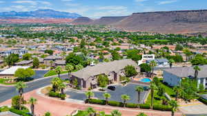Aerial view of residential area featuring mountains