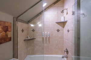 Full bathroom featuring shower / bath combination with glass door