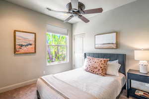 Bedroom featuring carpet flooring and ceiling fan