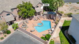 Aerial view of property and surrounding area with a pool area