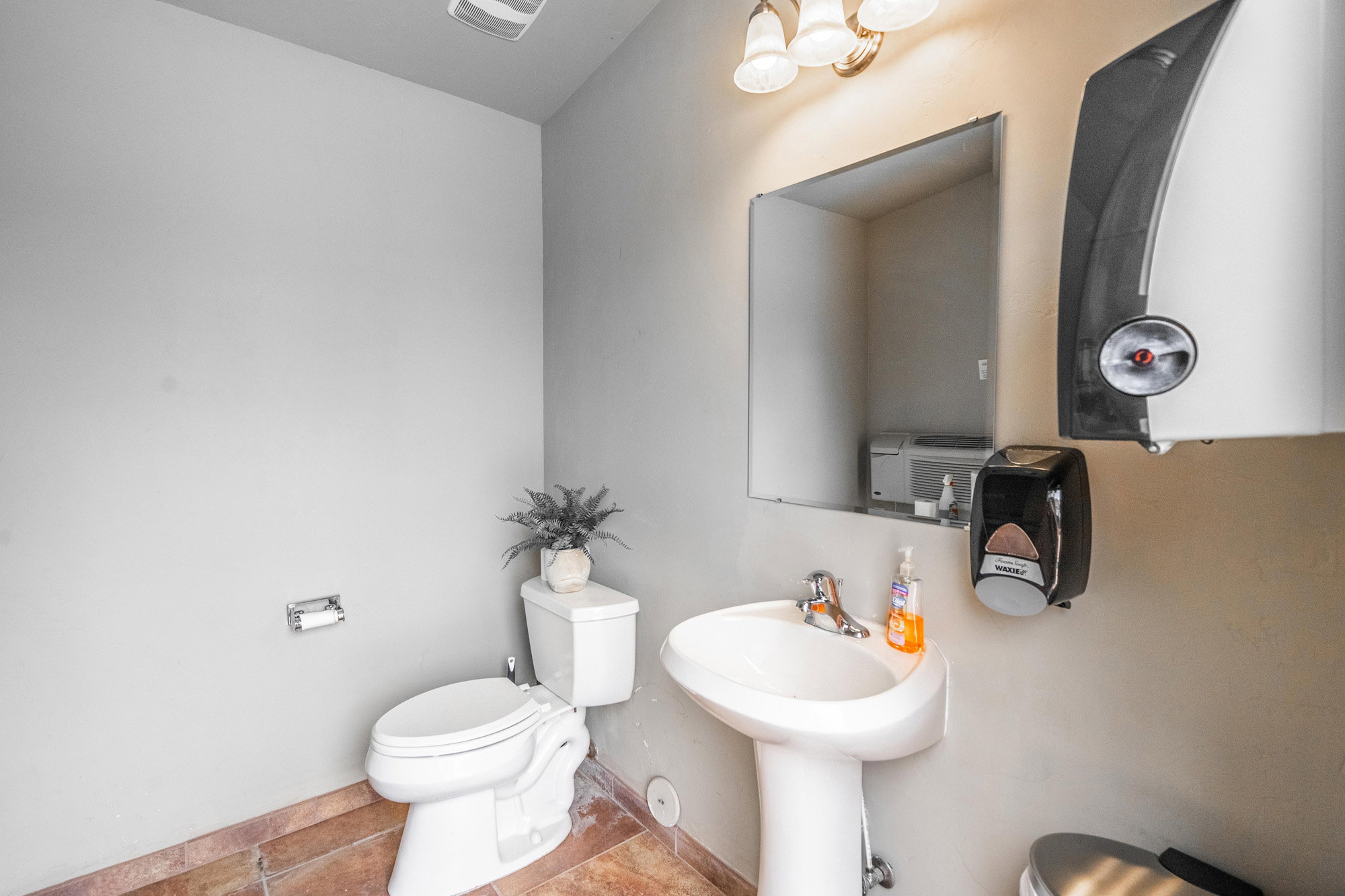 Bathroom with toilet and tile patterned flooring