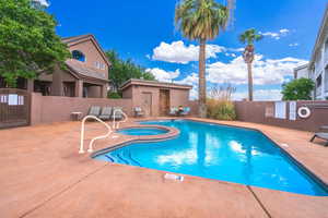 Community pool featuring a patio and a community hot tub