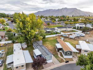 Aerial view of residential area featuring a mountainous background