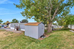 View of yard featuring a storage shed