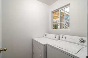 Laundry area with washer and clothes dryer