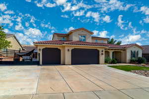 Mediterranean / spanish-style home with stucco siding, concrete driveway, an attached garage, and a tile roof