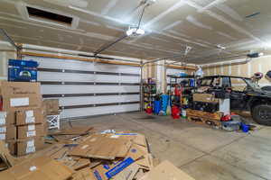 Garage featuring a garage door opener