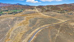View of property location featuring a mountain backdrop and rural landscape