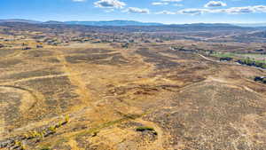 Aerial view of sparsely populated area featuring a mountainous background