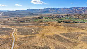 View of mountain backdrop with rural landscape