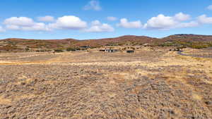 View of mountain backdrop featuring rural landscape