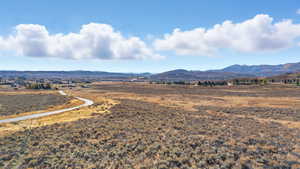 View of mountain backdrop featuring rural landscape