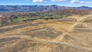 Aerial view of sparsely populated area with a mountain backdrop