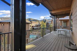 Deck featuring a mountain view, outdoor seating area