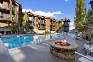 Salt-Water 25-Yard Pool with a Patio Area and Firepit