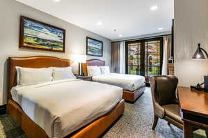 Carpeted bedroom featuring access to outside and recessed lighting