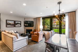 Beautiful living area featuring fireplace and balcony.