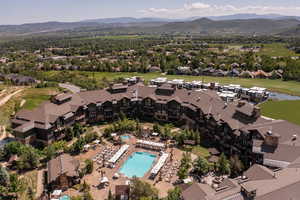 Bird's eye view of a pool area and a water and mountain view