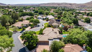 Aerial perspective of suburban area featuring a mountainous background