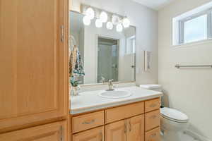 Bathroom with toilet and vanity