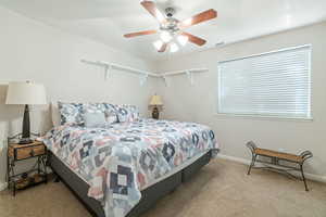 Bedroom with carpet floors and ceiling fan