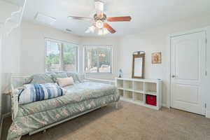 Bedroom featuring carpet flooring and ceiling fan