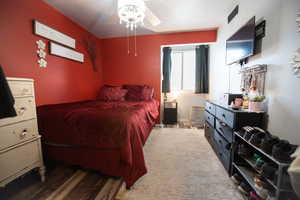 Bedroom with wood finished floors and ceiling fan
