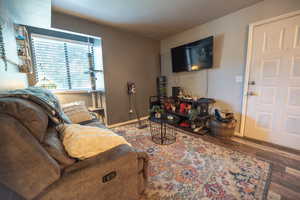 Living area featuring wood finished floors and baseboards