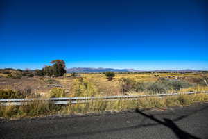 View of mountain backdrop with rural landscape