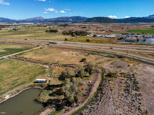 Overview of rural landscape featuring a water and mountain view