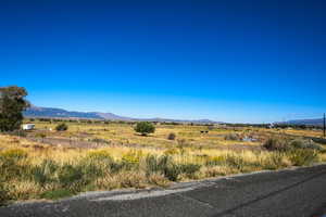 View of mountain background featuring rural landscape